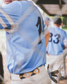A man in a Moontowers baseball uniform.