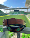A Verde leather belt sitting on top of a stadium by Zilker Belts.