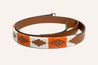 An Zilker Belts orange and white belt with a geometric pattern.