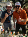 Two men posing for a picture wearing the Zilker Belts Imperial ATX Hat (Gift).