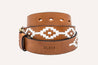 Argentine leather Rambler belt with white hand-stitched patterns and a gold-toned buckle on a white background by Zilker Belts.