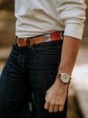 a man wearing Landshark jeans and a Zilker Belts belt.