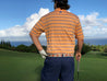 the back of a man wearing a Zilker Belts ATX Light standing on a golf course.