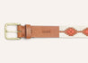 a Zilker Belts ATX Light belt with a tan and orange pattern.