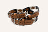 Dark brown leather dog collar with black and white stitching. Zilker Belt logo embossing. Zilker Belt logo embossing. Image showcases 3 sizes: small dog collar, medium dog collar, and large dog collar.