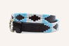 A Argentina Kids belt with a black leather Zilker Belts belt.
