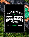 The logo for Austin FC Verde belts.
