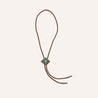 A Zilker Belts brown leather necklace with a Zilker Bolo Tie turquoise stone.