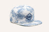 A white and blue Imperial Summer Hat with palm leaves on it from Zilker Belts.