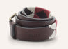 A Reveille belt with a red and white pattern by Zilker Belts.