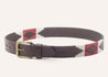 A Reveille belt by Zilker Belts in brown leather with a red and white pattern.